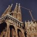 Stunning low-angle shot of La Sagrada Familia in Barcelona under a clear sky.